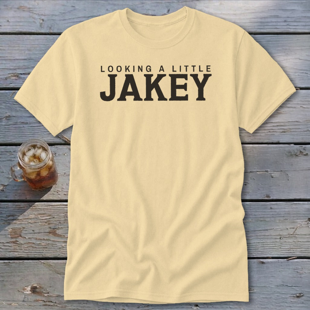 Light yellow t-shirt with black text "LOOKING A LITTLE JAKEY".