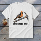 White t-shirt with a cardinal perched on a pickaxe, text reads "MOUNTAIN SOUL".