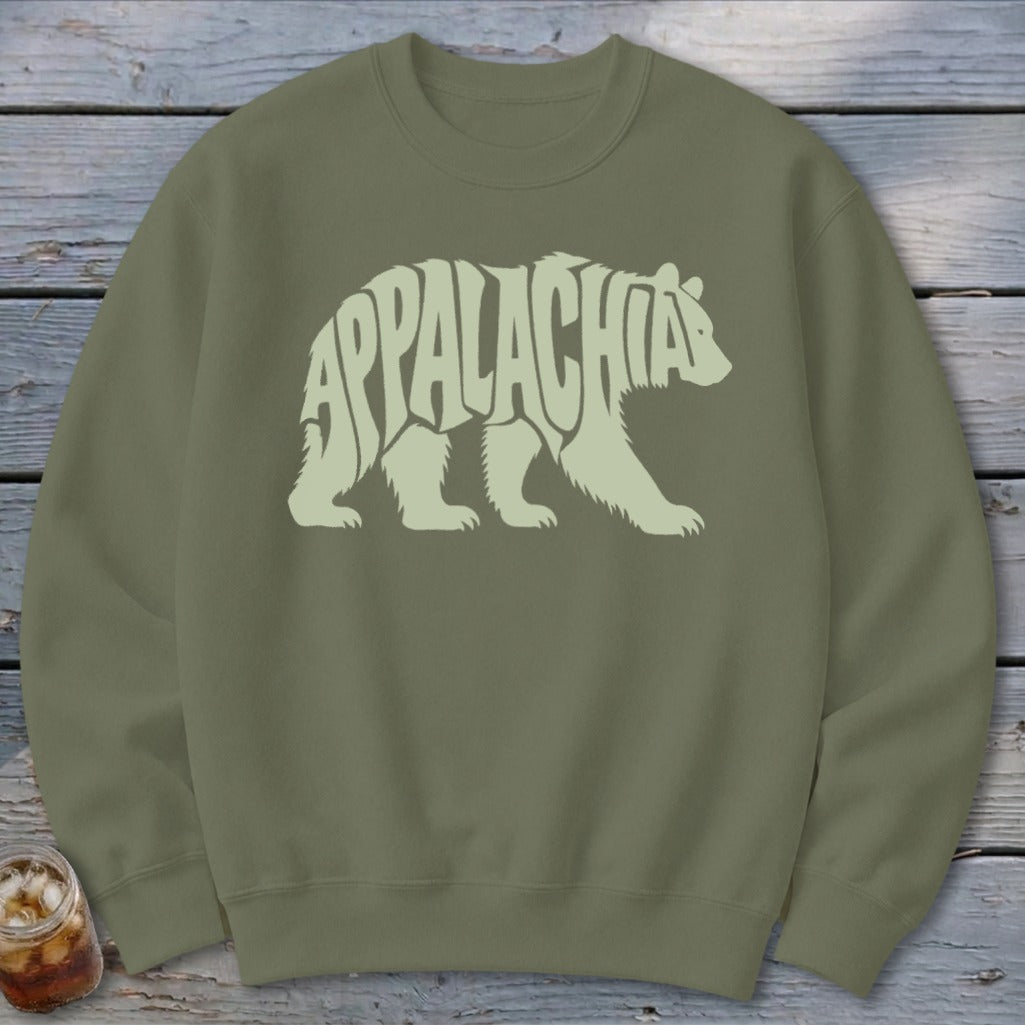 Olive green crewneck sweatshirt featuring a light green graphic of a walking bear filled with the text Appalachia.