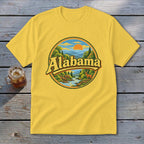 Yellow t-shirt with circular Alabama landscape graphic featuring deer and river.