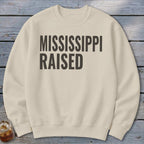 Light cream sweatshirt with "MISSISSIPPI RAISED" text in dark gray.