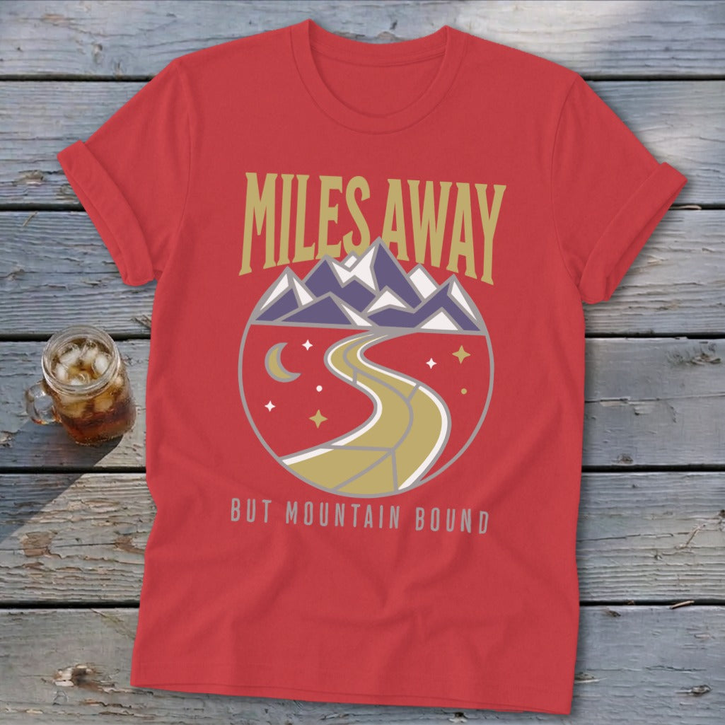 Red t-shirt with "MILES AWAY BUT MOUNTAIN BOUND" text and mountain graphic.