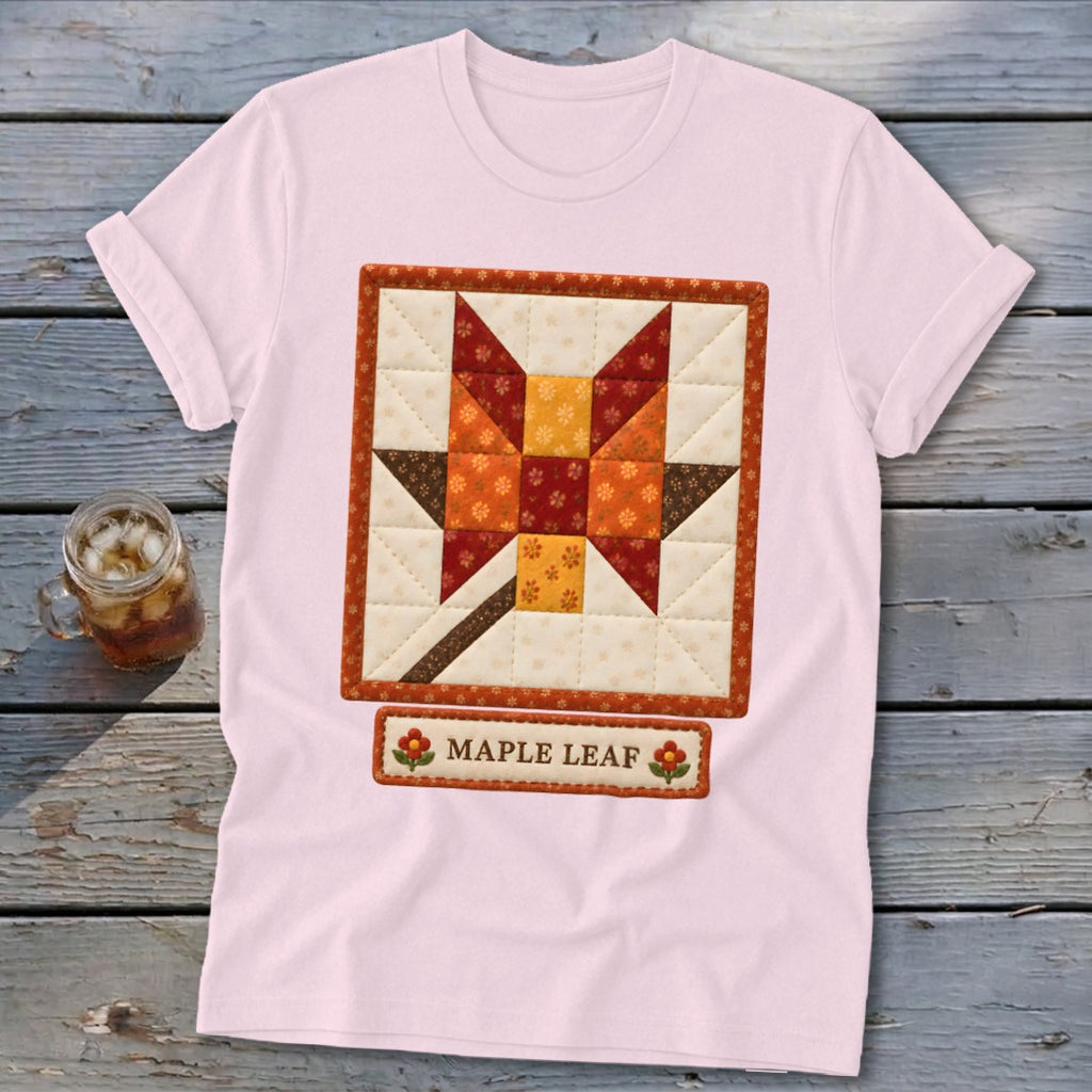 Pink t-shirt featuring a quilt-style maple leaf design and "MAPLE LEAF" text.