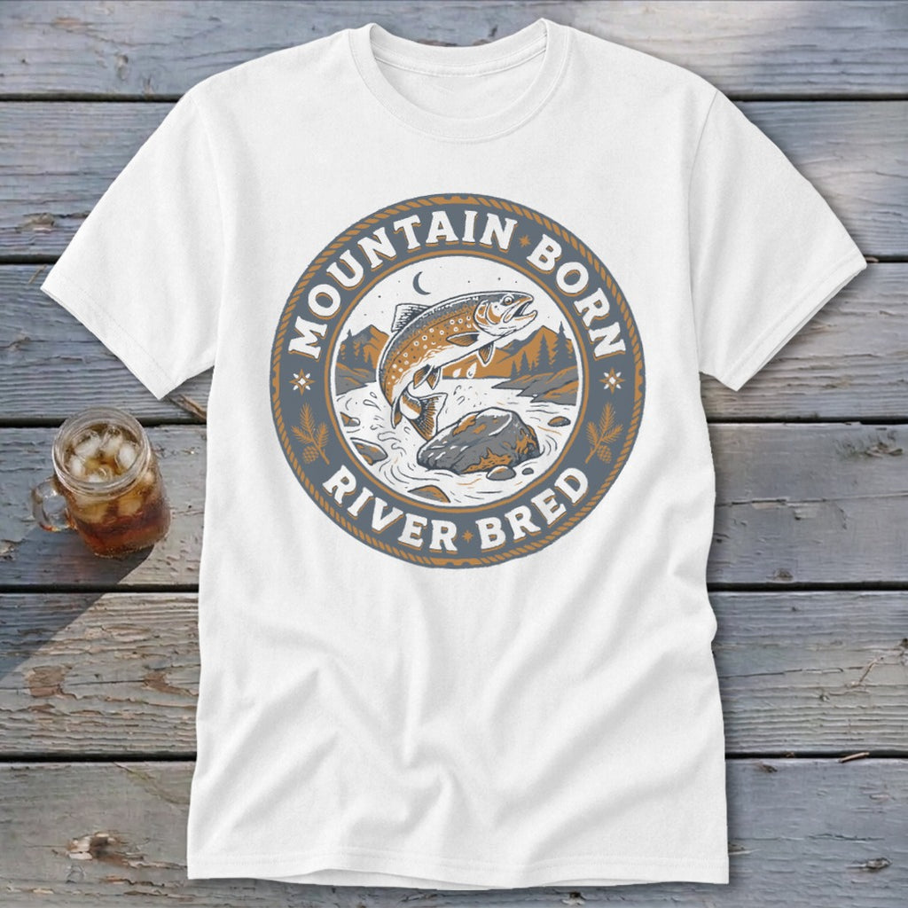 White t-shirt with circular logo featuring a jumping fish, mountains, and text "Mountain Born River Bred".
