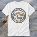 White t-shirt with circular logo featuring a jumping fish, mountains, and text "Mountain Born River Bred".