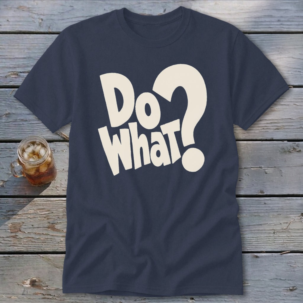 A dark blue t-shirt printed with the white text Do What and a question mark lies on a wooden background.