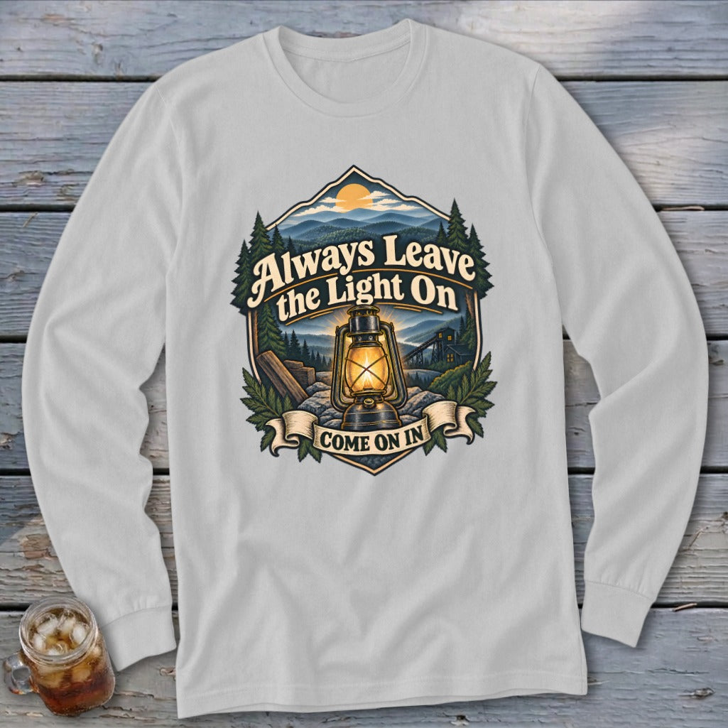 Graphic on white long-sleeve shirt: Always Leave the Light On, Come On In.