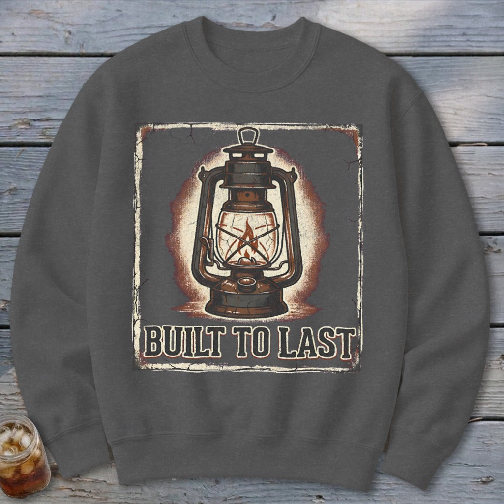 Dark gray sweatshirt with vintage lantern graphic and text "BUILT TO LAST".