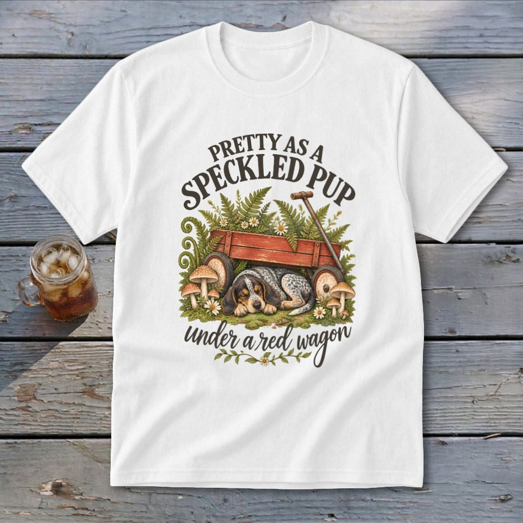 White t-shirt with graphic of a dog under a red wagon, saying "Pretty as a speckled pup".