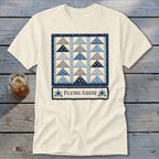 Cream t-shirt with a blue quilt pattern and the words "Flying Geese".