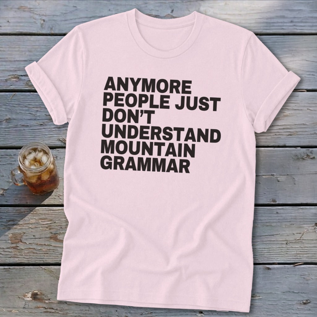 Light pink t-shirt with black text that reads "Anymore people just don't understand mountain grammar".