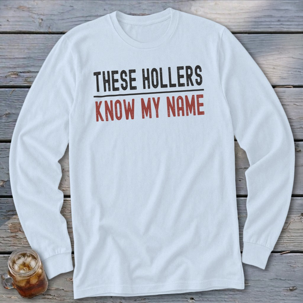 White long-sleeve shirt with "THESE HOLLERS KNOW MY NAME" text.