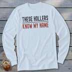 White long-sleeve shirt with "THESE HOLLERS KNOW MY NAME" text.