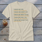 Cream t-shirt with "Things We Did" list including "Loaded 16 tons" and "Hang Down our Heads."