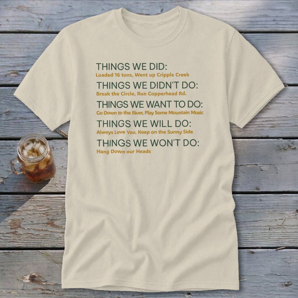 Cream t-shirt with "Things We Did" list including "Loaded 16 tons" and "Hang Down our Heads."