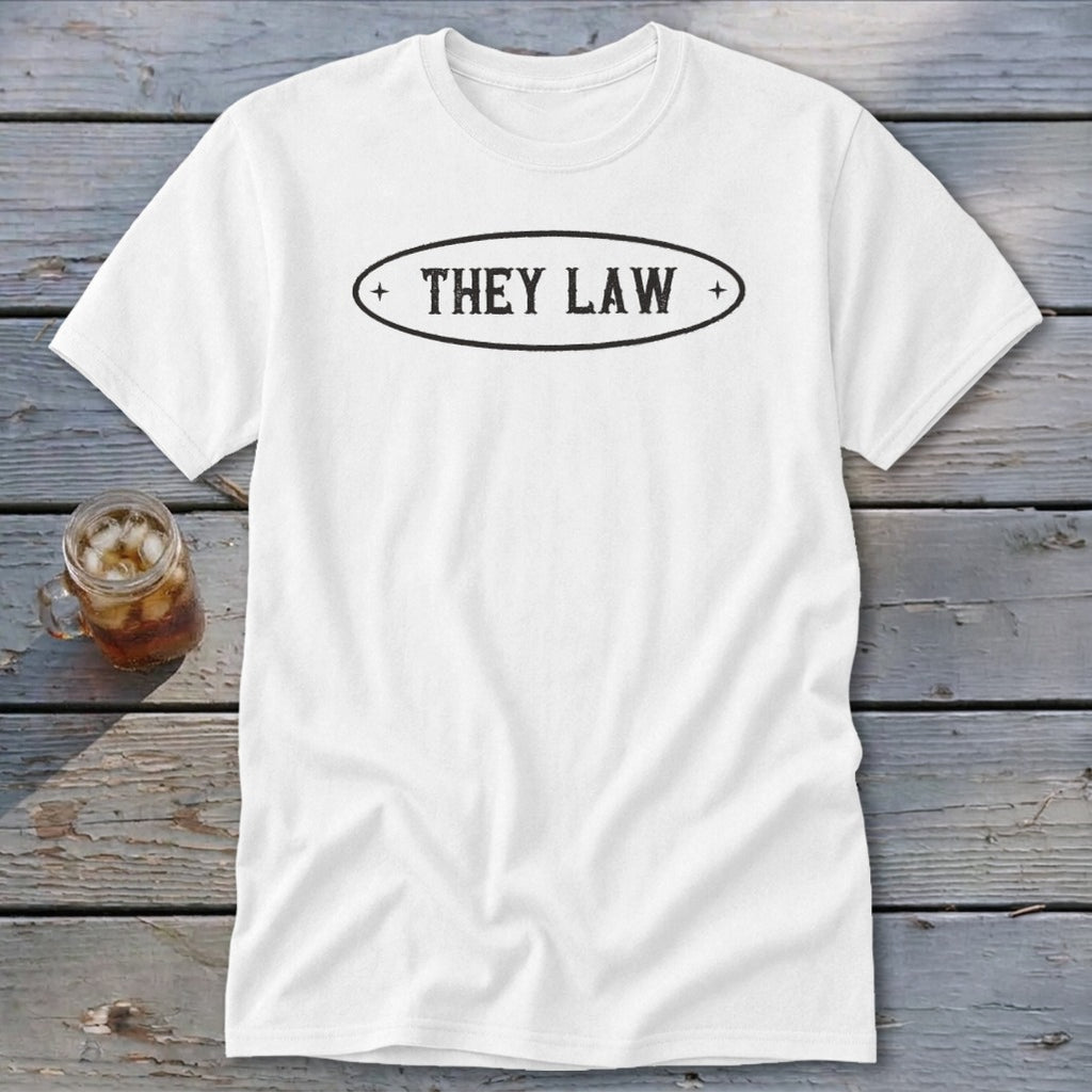 White t-shirt with black oval logo reading "THEY LAW".