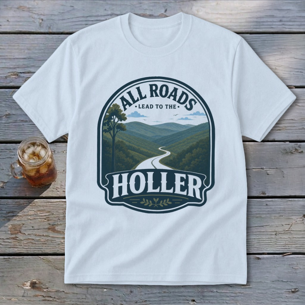 White t-shirt with a circular graphic showing a winding road through mountains and the text "All Roads Lead to the Holler".