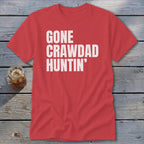 Red t-shirt with white text that reads "GONE CRAWDAD HUNTIN'".