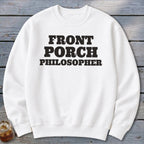 White sweatshirt with "FRONT PORCH PHILOSOPHER" printed in black bold letters.