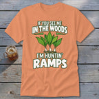 Peach t-shirt with green text reading "IF YOU SEE ME IN THE WOODS I'M HUNTIN' RAMPS" and an illustration of ramps.