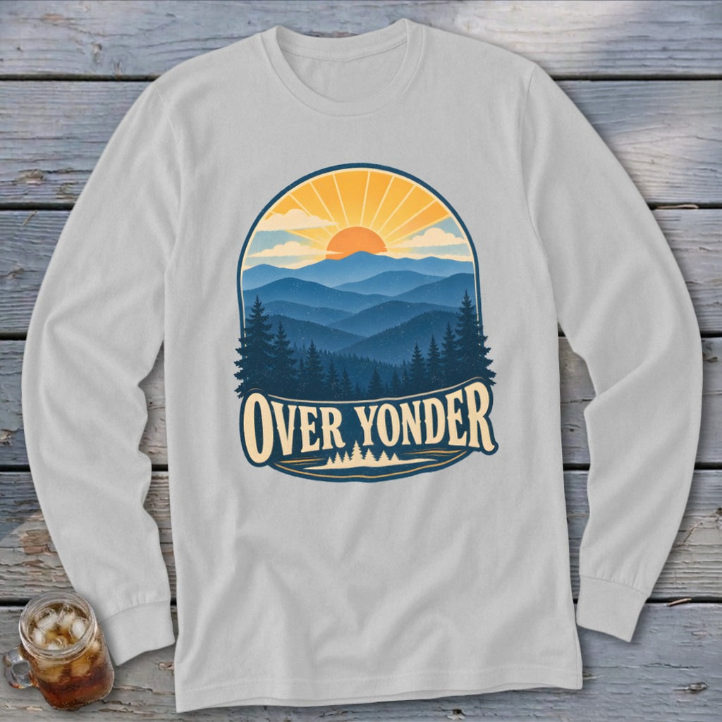 Light gray long-sleeve t-shirt with a vintage graphic of layered blue mountains, evergreen trees, and a setting sun labeled OVER YONDER.