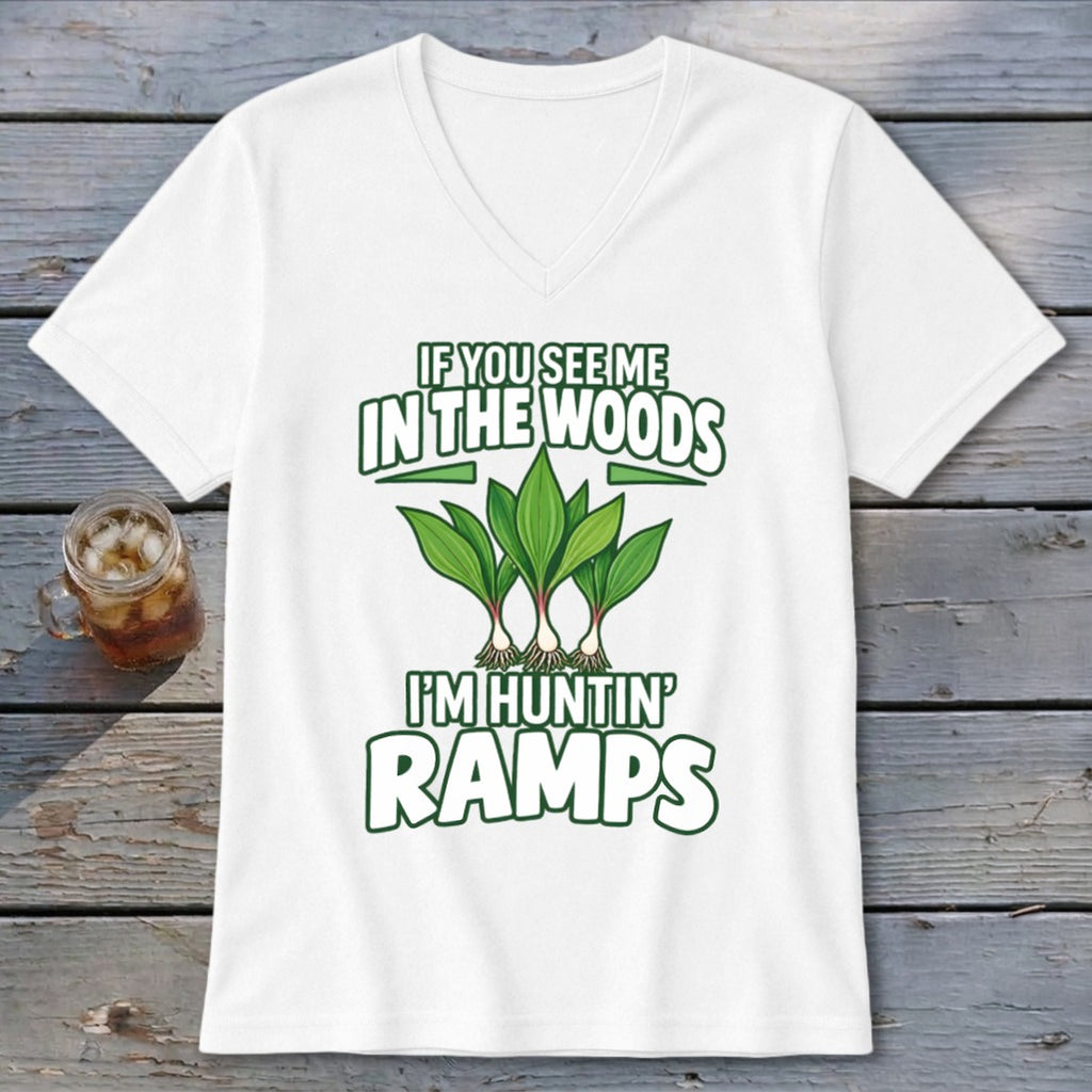 White v-neck t-shirt with green text and illustrations of ramp plants, captioned If You See Me In The Woods I'm Huntin' Ramps.