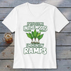 White v-neck t-shirt with green text and illustrations of ramp plants, captioned If You See Me In The Woods I'm Huntin' Ramps.