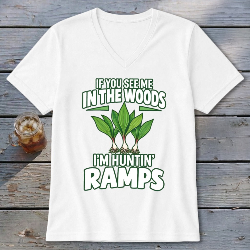 White v-neck t-shirt with green text and illustrations of ramp plants, captioned If You See Me In The Woods I'm Huntin' Ramps.