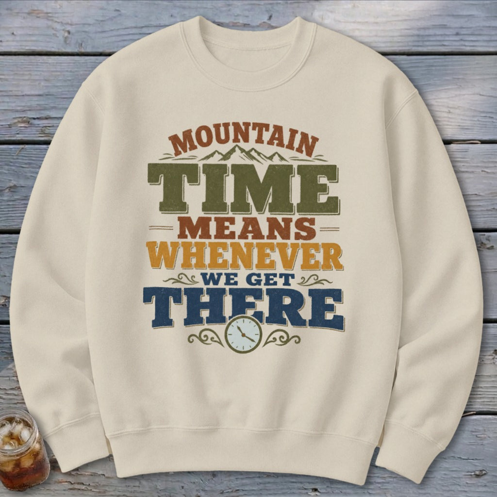 Cream sweatshirt with "Mountain Time Means Whenever We Get There" graphic and clock.