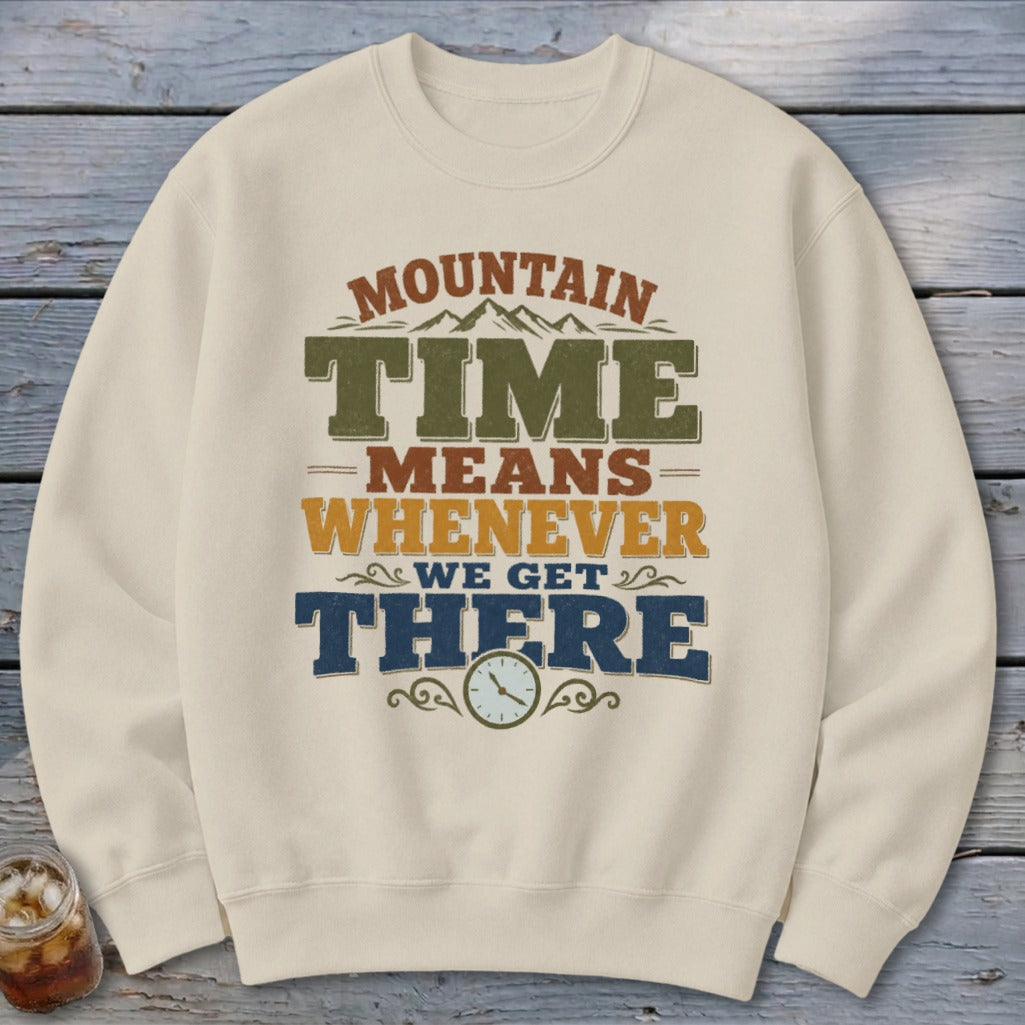 Cream sweatshirt with "Mountain Time Means Whenever We Get There" graphic and clock.