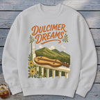 White sweatshirt with "Dulcimer Dreams" text and dulcimer on railing.