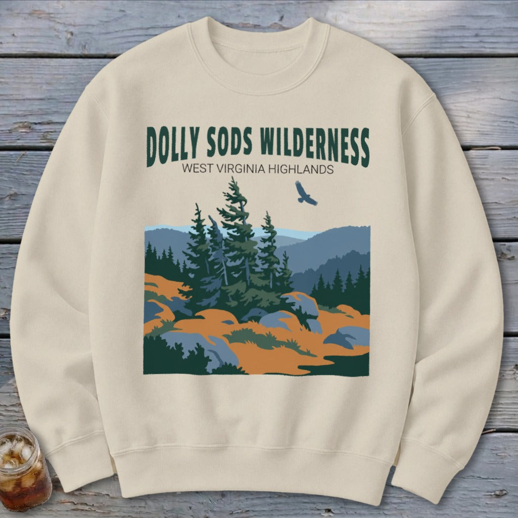 Cream crewneck sweatshirt featuring a graphic of Dolly Sods Wilderness with pine trees and mountains.