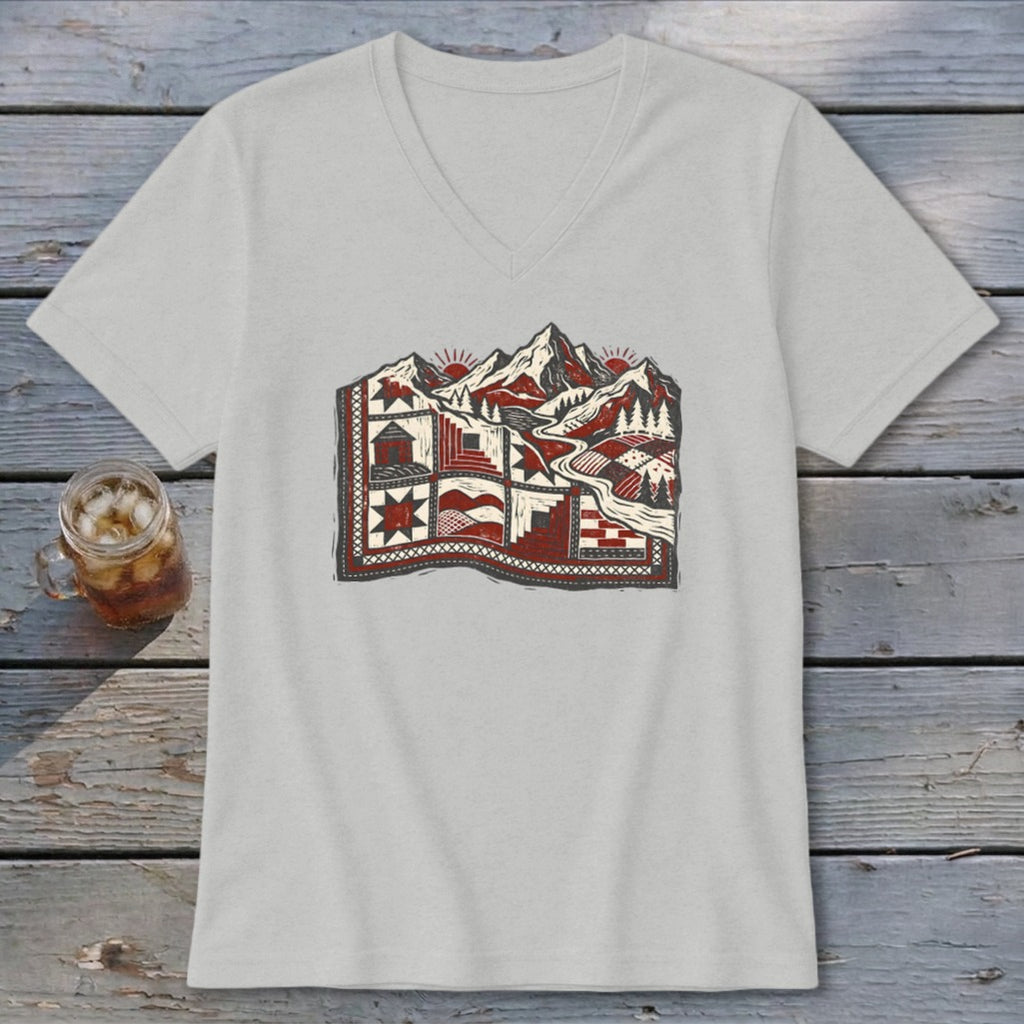 Light gray v-neck t-shirt featuring a stylized graphic of a mountain quilt landscape.