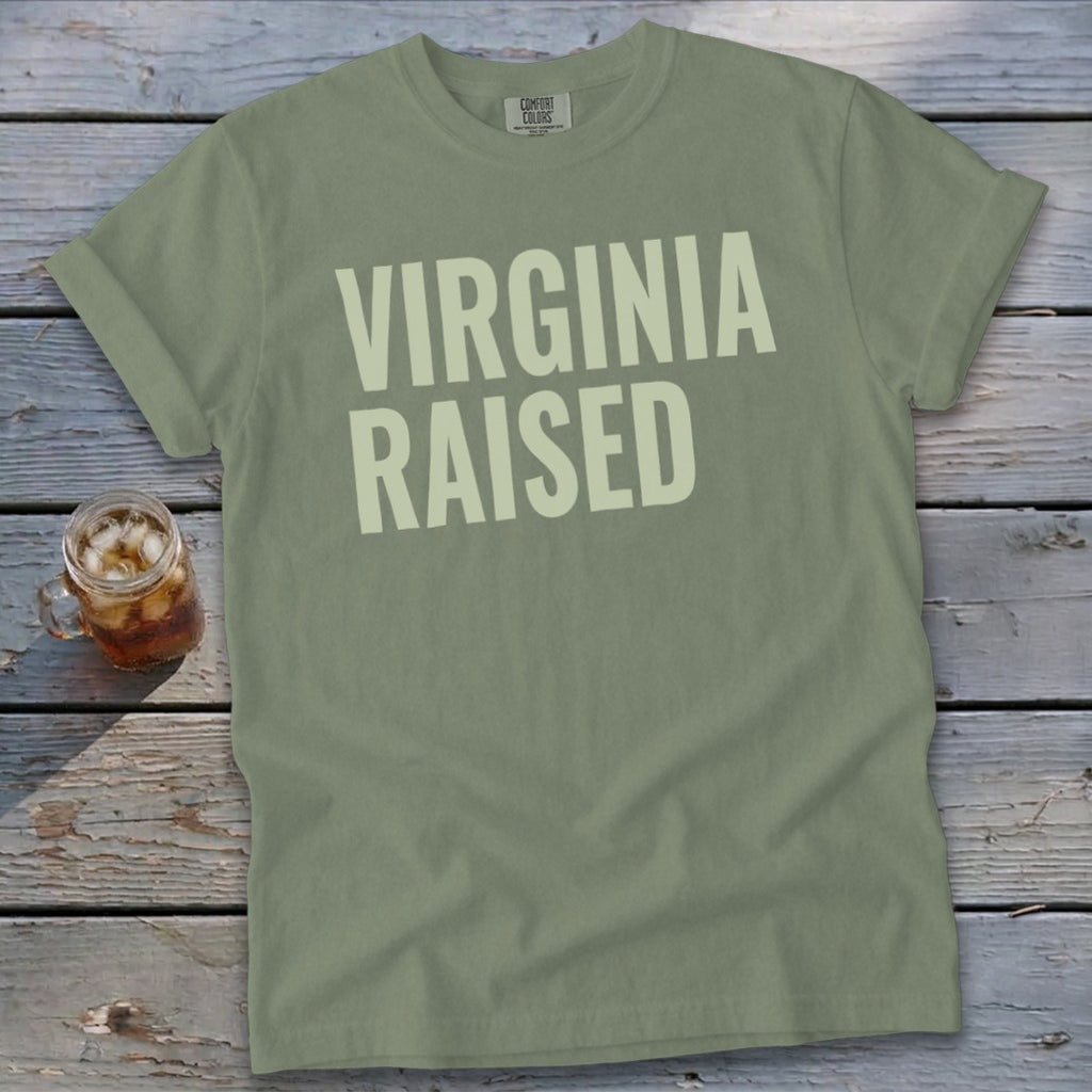Olive green t-shirt with "VIRGINIA RAISED" text in cream.