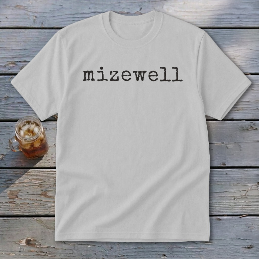 White t-shirt with "mizewell" printed in black typewriter font.