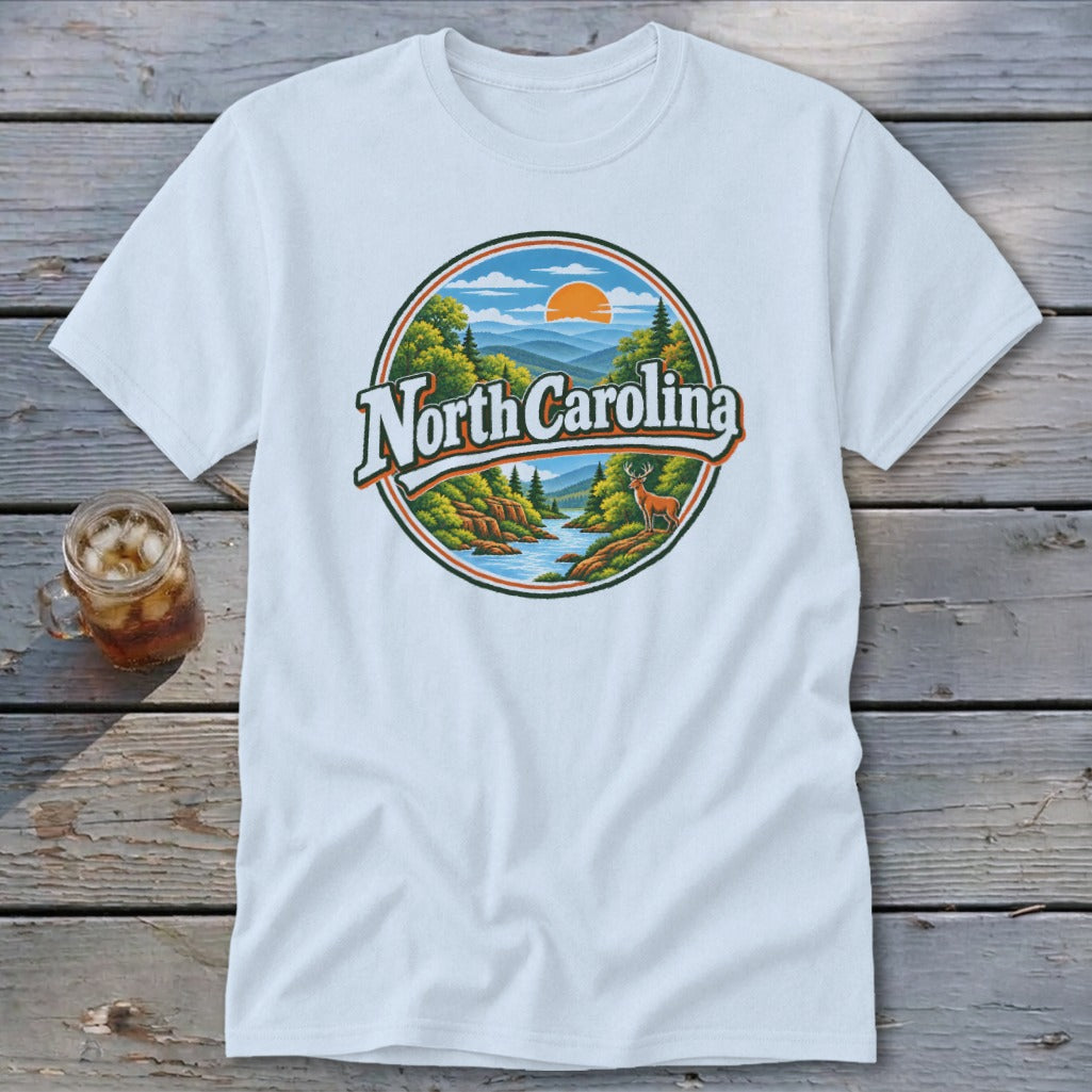White t-shirt with a circular graphic of North Carolina landscape, mountains, deer, and river.