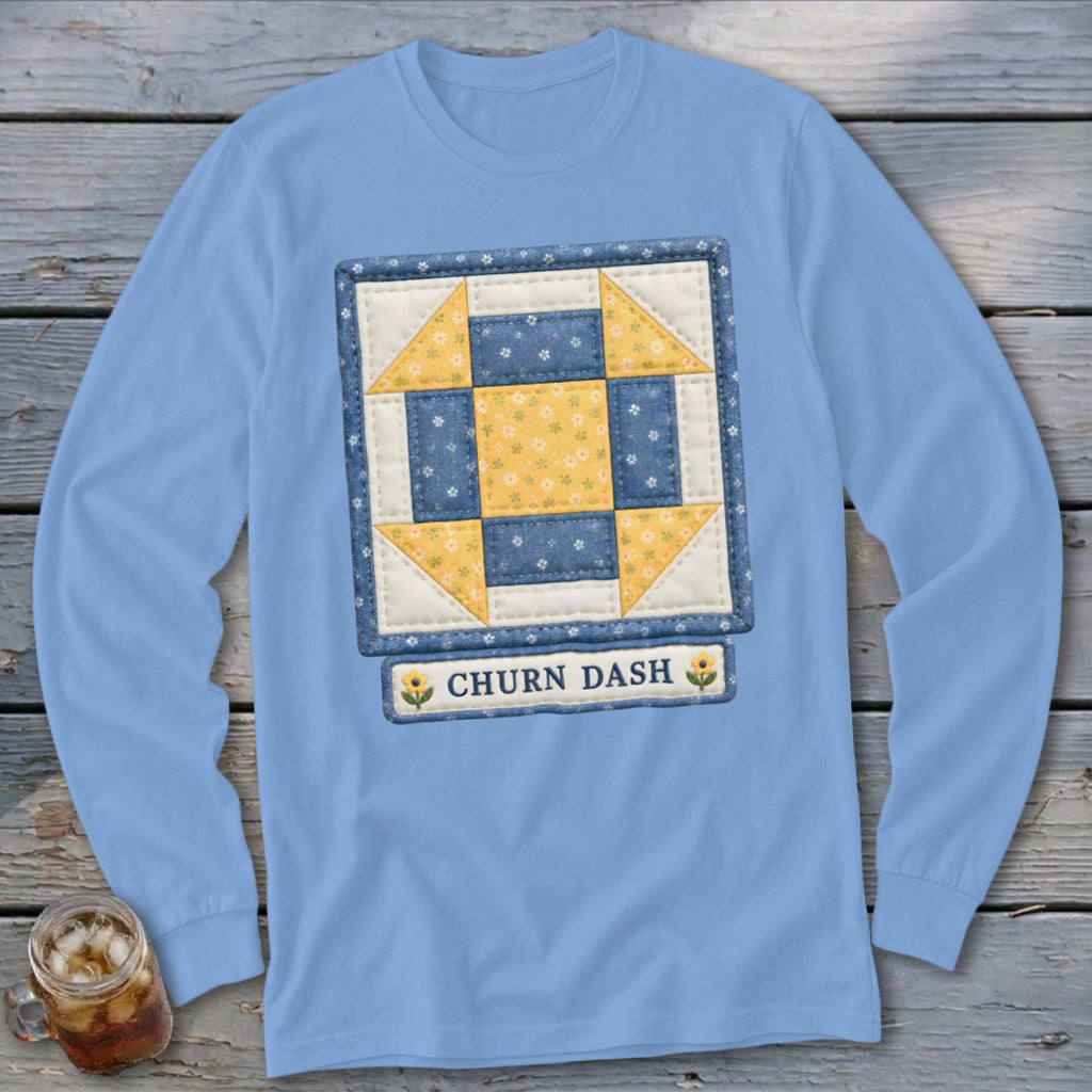 Light blue long sleeve shirt with Churn Dash quilt block design and text.