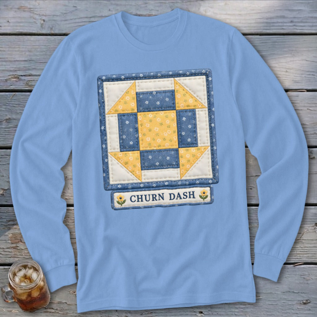 Light blue long sleeve shirt with Churn Dash quilt block design and text.
