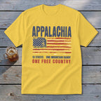 A yellow t-shirt features a distressed graphic with the text Appalachia, a stylized American flag, and the phrase 13 States, One Mountain Range, One Free Country.