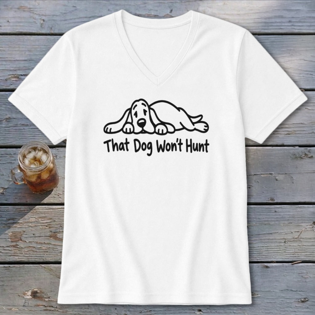 A white V-neck t-shirt featuring a graphic of a sleeping hound dog and the text That Dog Won't Hunt.