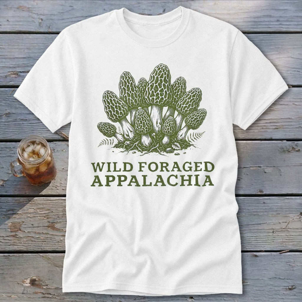 White t-shirt with green illustration of morel mushrooms and text "Wild Foraged Appalachia".
