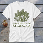White t-shirt with green illustration of morel mushrooms and text "Wild Foraged Appalachia".