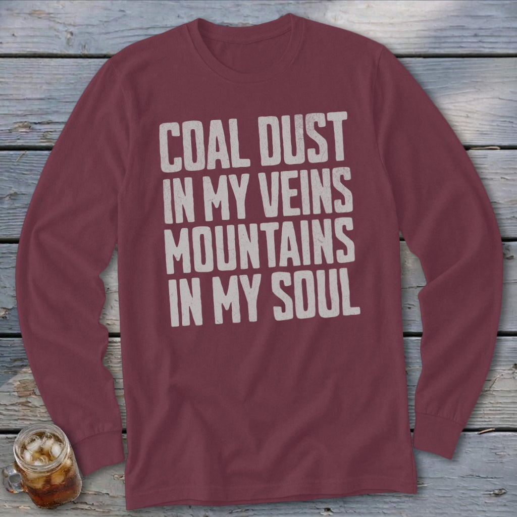 A maroon long-sleeve t-shirt with white distressed text that reads COAL DUST IN MY VEINS MOUNTAINS IN MY SOUL.