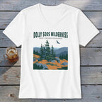 White V-neck t-shirt featuring a retro graphic of Dolly Sods Wilderness with pine trees and mountains.