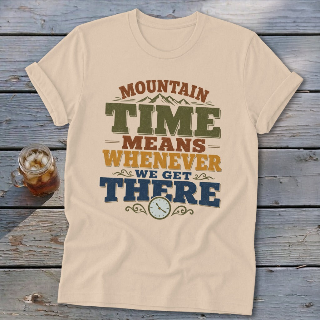 Cream t-shirt with "Mountain Time Means Whenever We Get There" text and clock graphic.