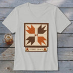 Light grey v-neck shirt featuring a "Turkey Track" quilt block design.