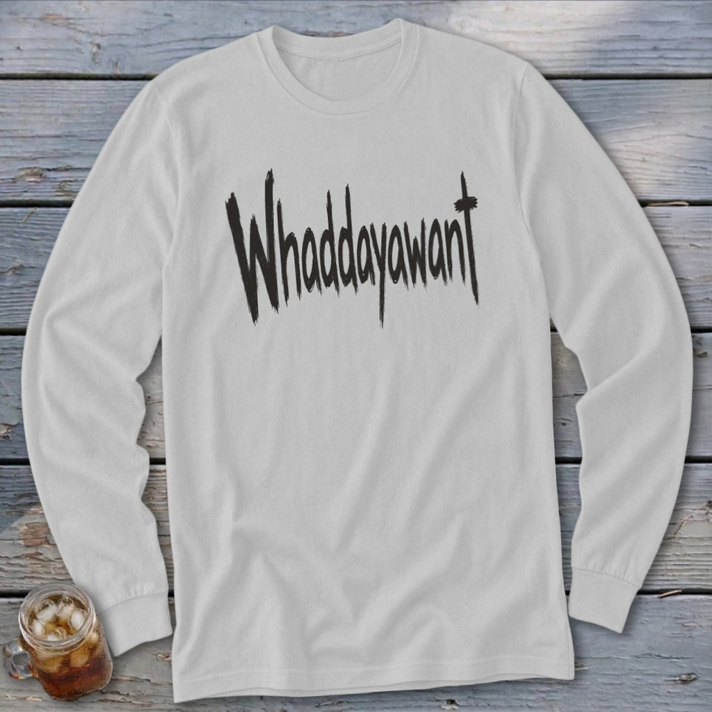 White long-sleeve shirt with "Whaddayawant" text printed in black brush strokes.