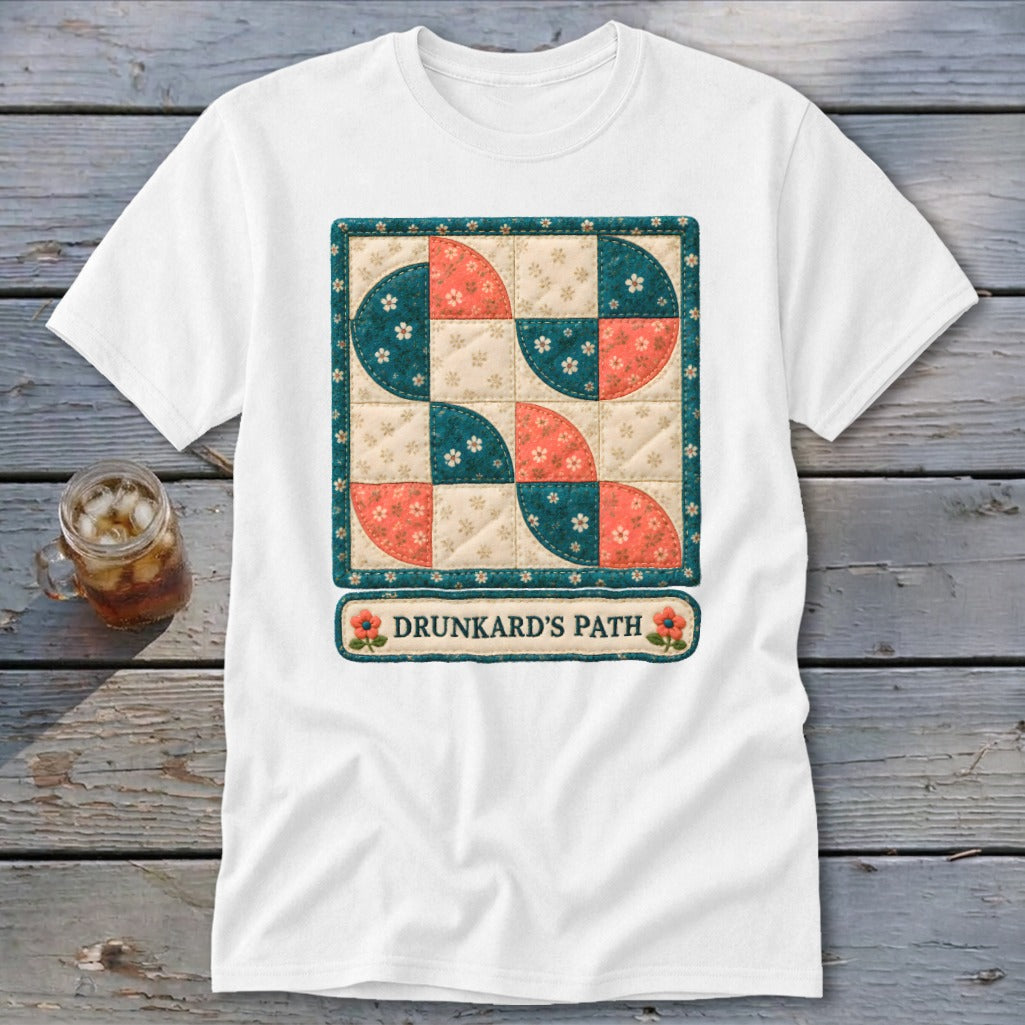 White t-shirt featuring a quilt square design with text "Drunkard's Path".