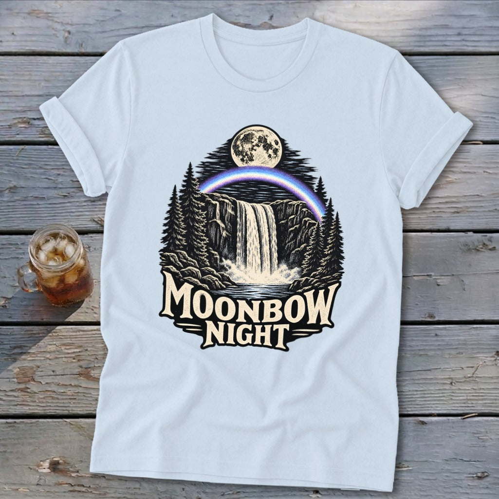 Light blue t-shirt with "Moonbow Night" text over a waterfall, moon, and rainbow graphic.