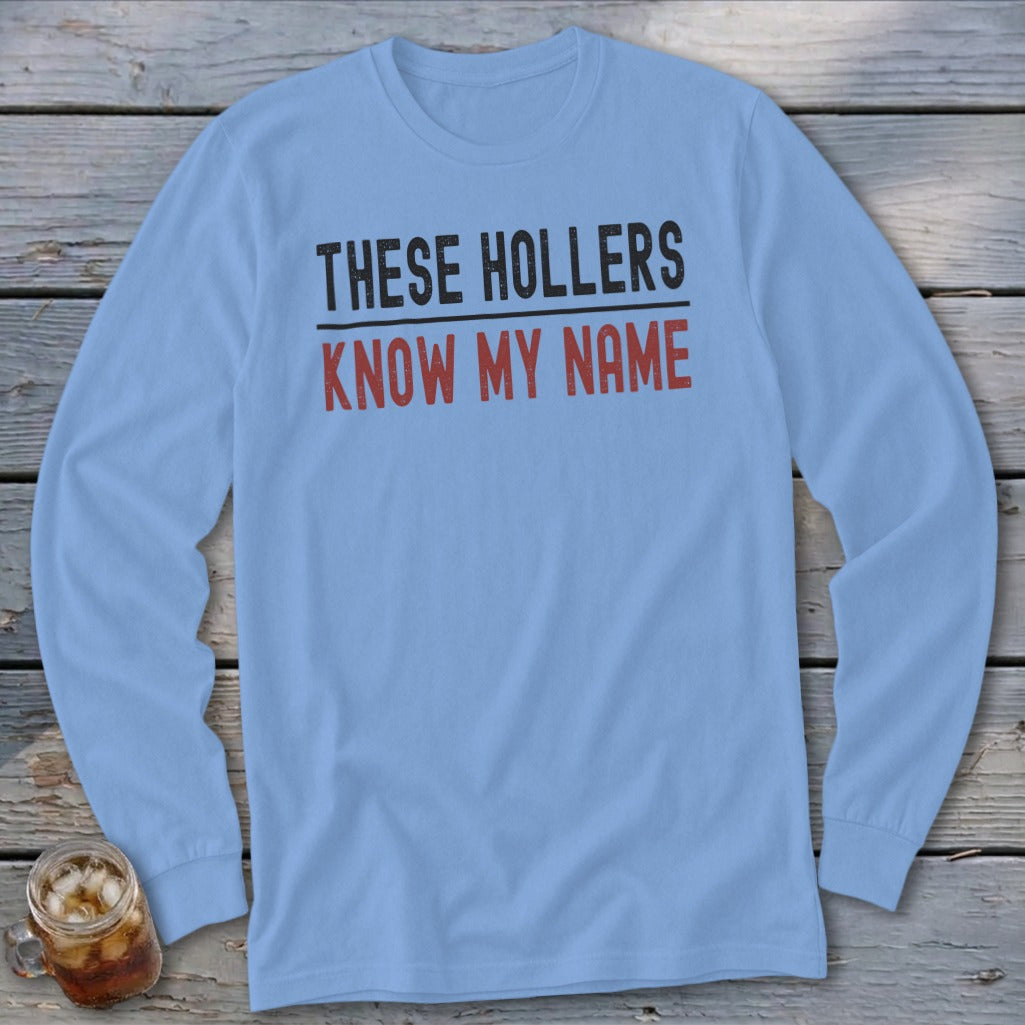 Light blue long sleeve shirt with "THESE HOLLERS KNOW MY NAME" printed on it.